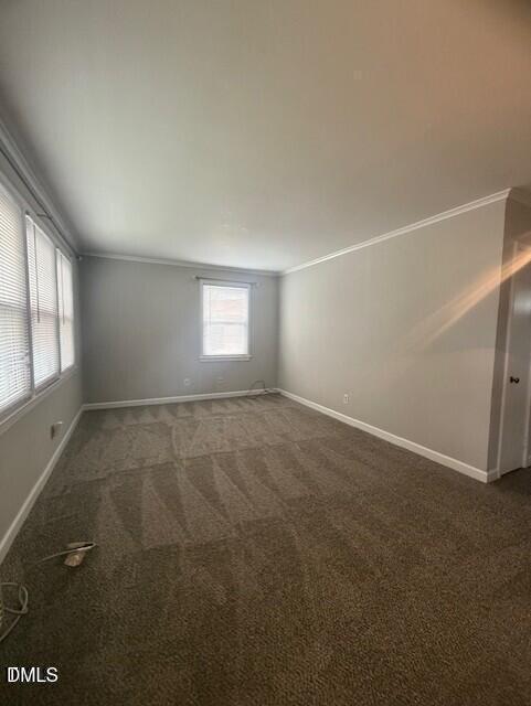 623 Daniels Street, Unit A Raleigh, NC 27605 - Photo 7 of 8 an empty room with windows