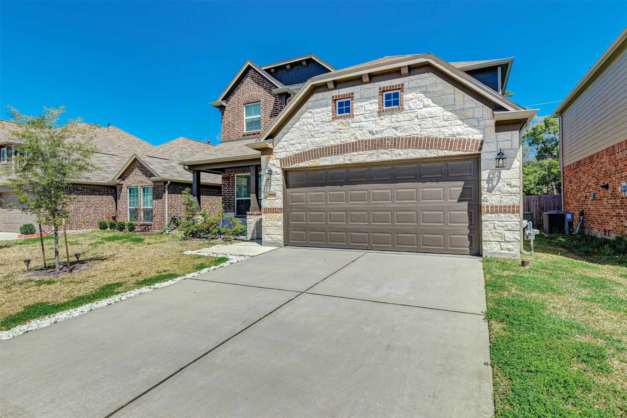 2293 Garden Square Path Spring, TX 77386 - Photo 3 of 32 a front view of a house with a yard