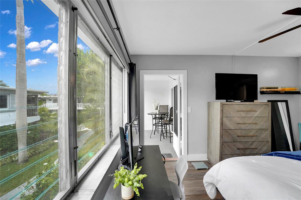 2161 Northeast 42nd Court, Unit 215 Lighthouse Point, FL 33064 - Photo 28 of 50 a view of a living room and dining room