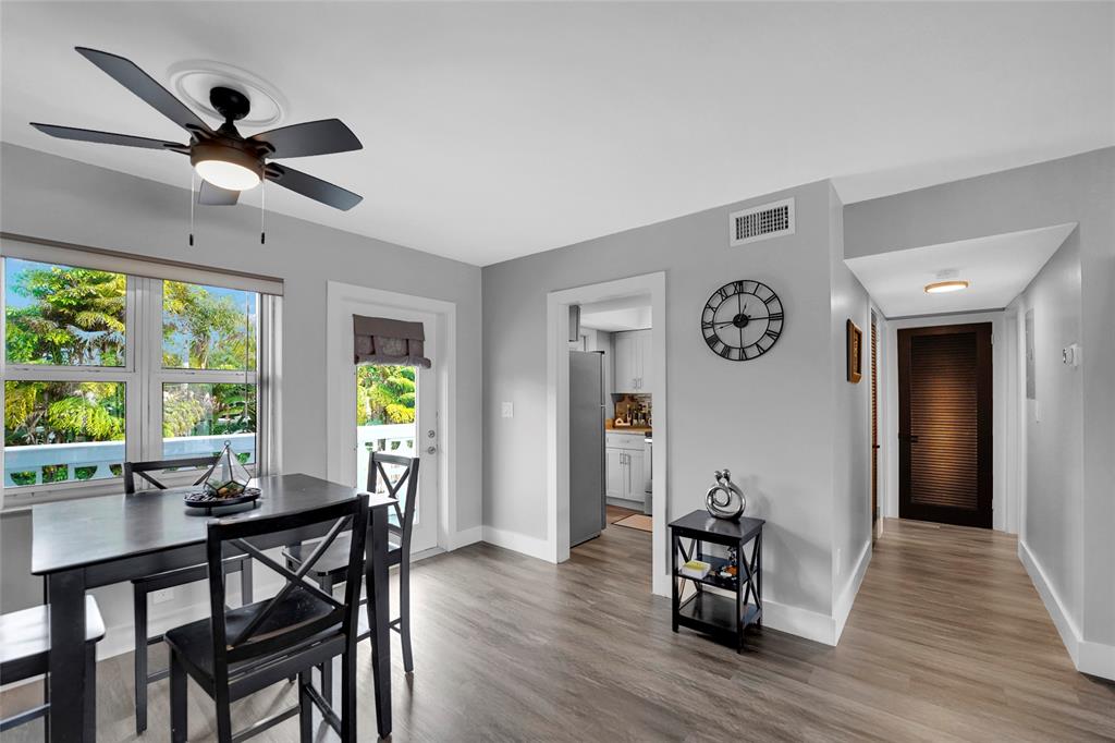 2161 Northeast 42nd Court, Unit 215 Lighthouse Point, FL 33064 - Photo 38 of 50 a view of a dining room with furniture window and wooden floor