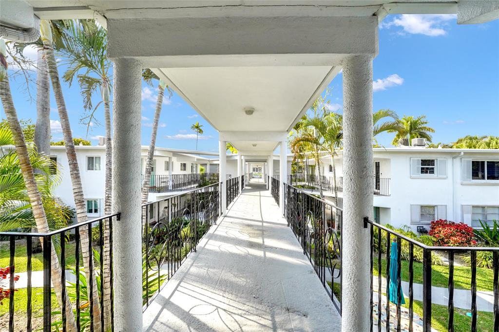 2161 Northeast 42nd Court, Unit 215 Lighthouse Point, FL 33064 - Photo 41 of 50 a view of a corridor