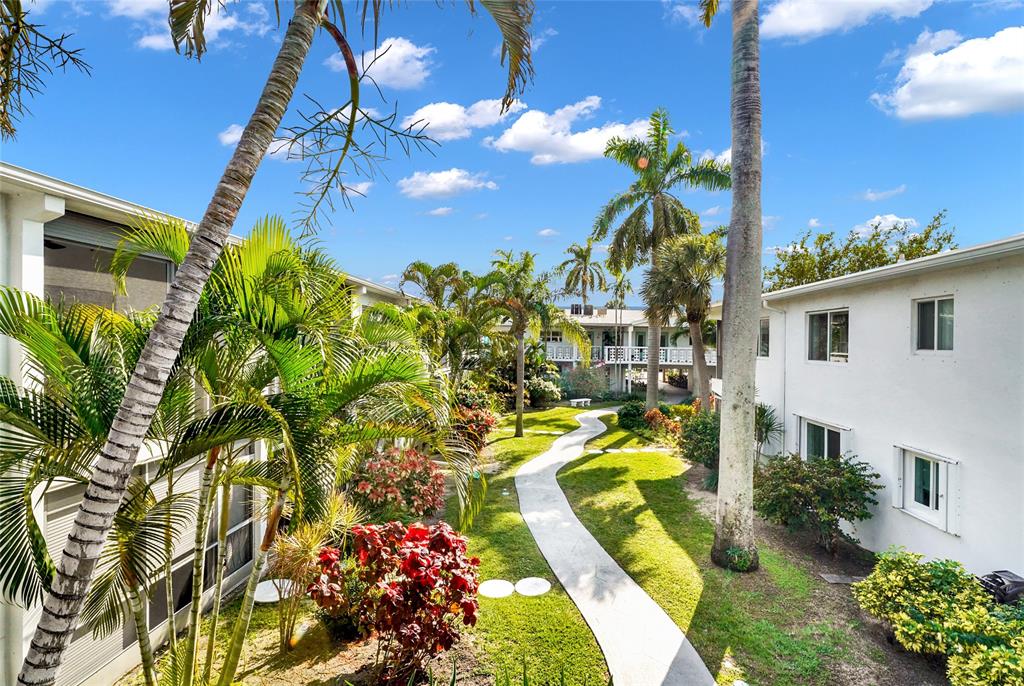 2161 Northeast 42nd Court, Unit 215 Lighthouse Point, FL 33064 - Photo 44 of 50 a view of a flower in a yard