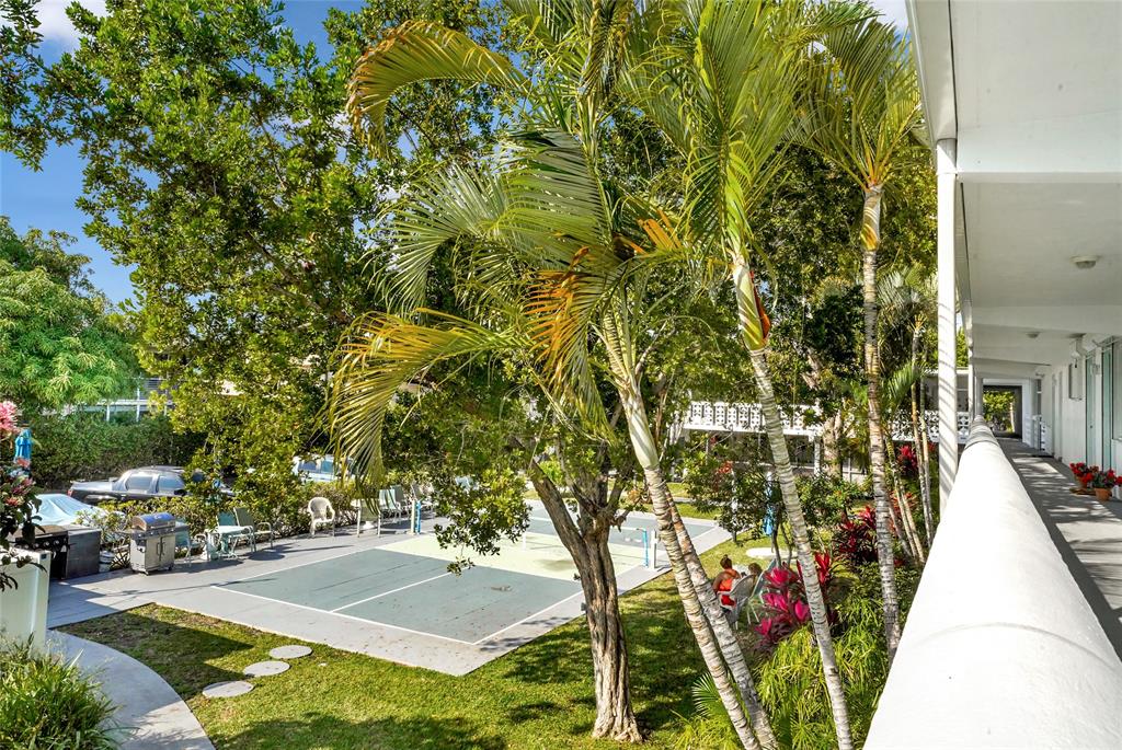 2161 Northeast 42nd Court, Unit 215 Lighthouse Point, FL 33064 - Photo 46 of 50 a view of a backyard