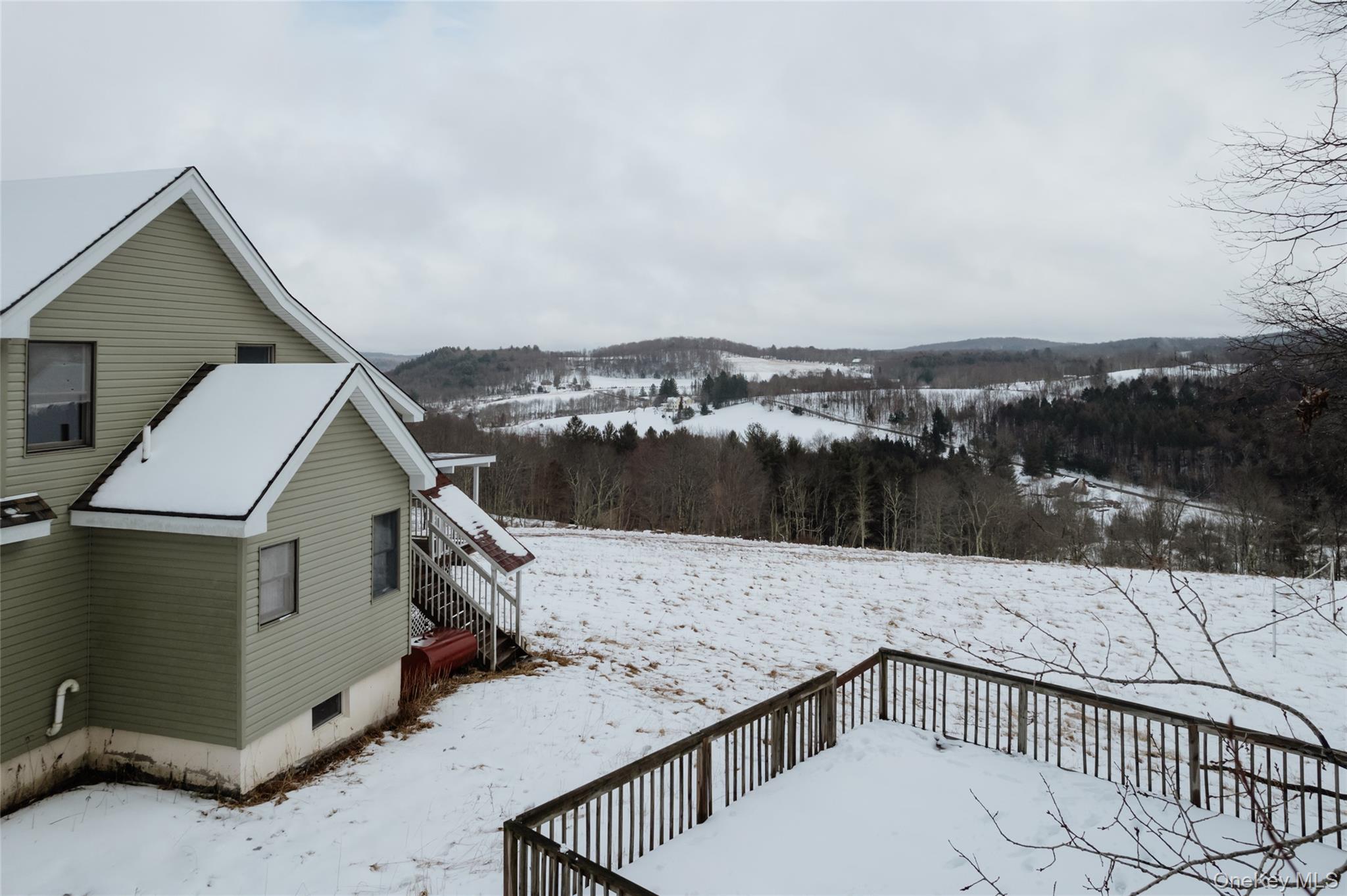 26 Beckys Hill Road Loch Sheldrake, NY 12759 - Photo 13 of 50 Yard covered in snow featuring a deck and stairs