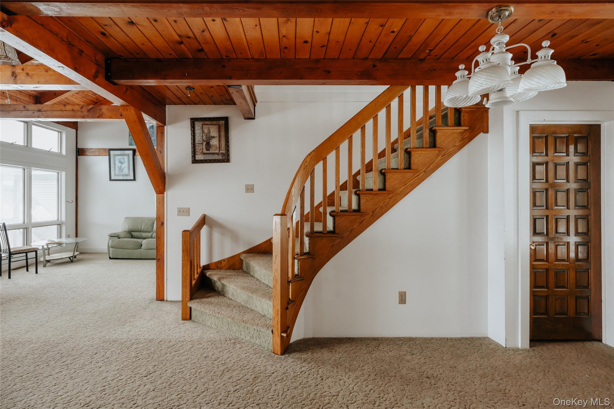 26 Beckys Hill Road Loch Sheldrake, NY 12759 - Photo 18 of 50 Stairway featuring carpet flooring, a wood ceiling with exposed beams, and a chandelier