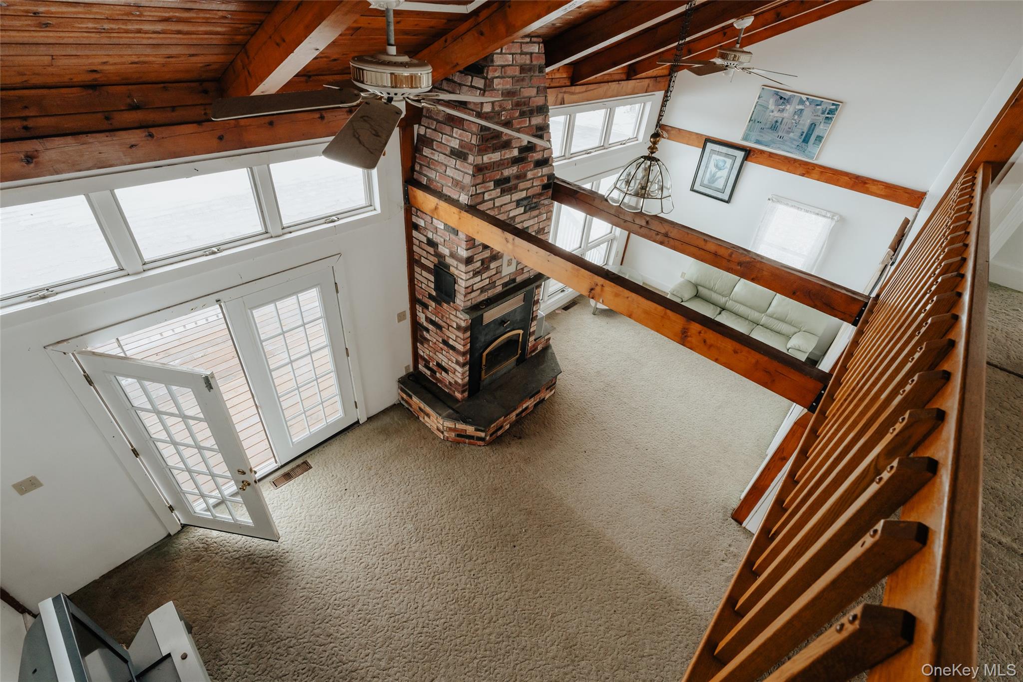 26 Beckys Hill Road Loch Sheldrake, NY 12759 - Photo 23 of 50 Unfurnished living room with ceiling fan, a high ceiling, carpet floors, and beamed ceiling