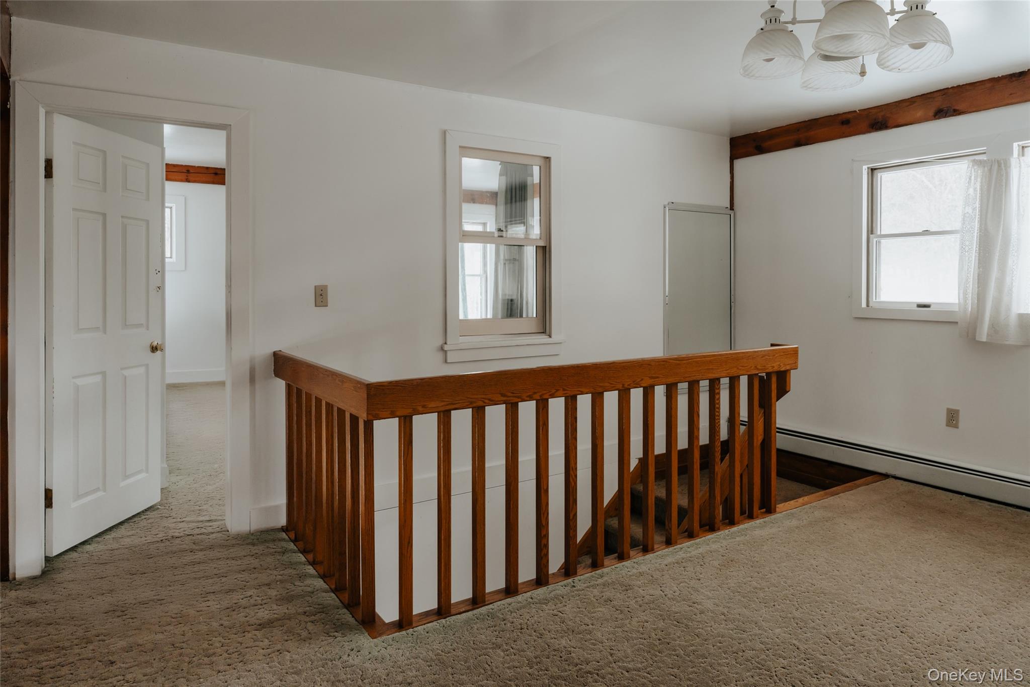 26 Beckys Hill Road Loch Sheldrake, NY 12759 - Photo 24 of 50 Corridor featuring an upstairs landing, carpet floors, and healthy amount of natural light