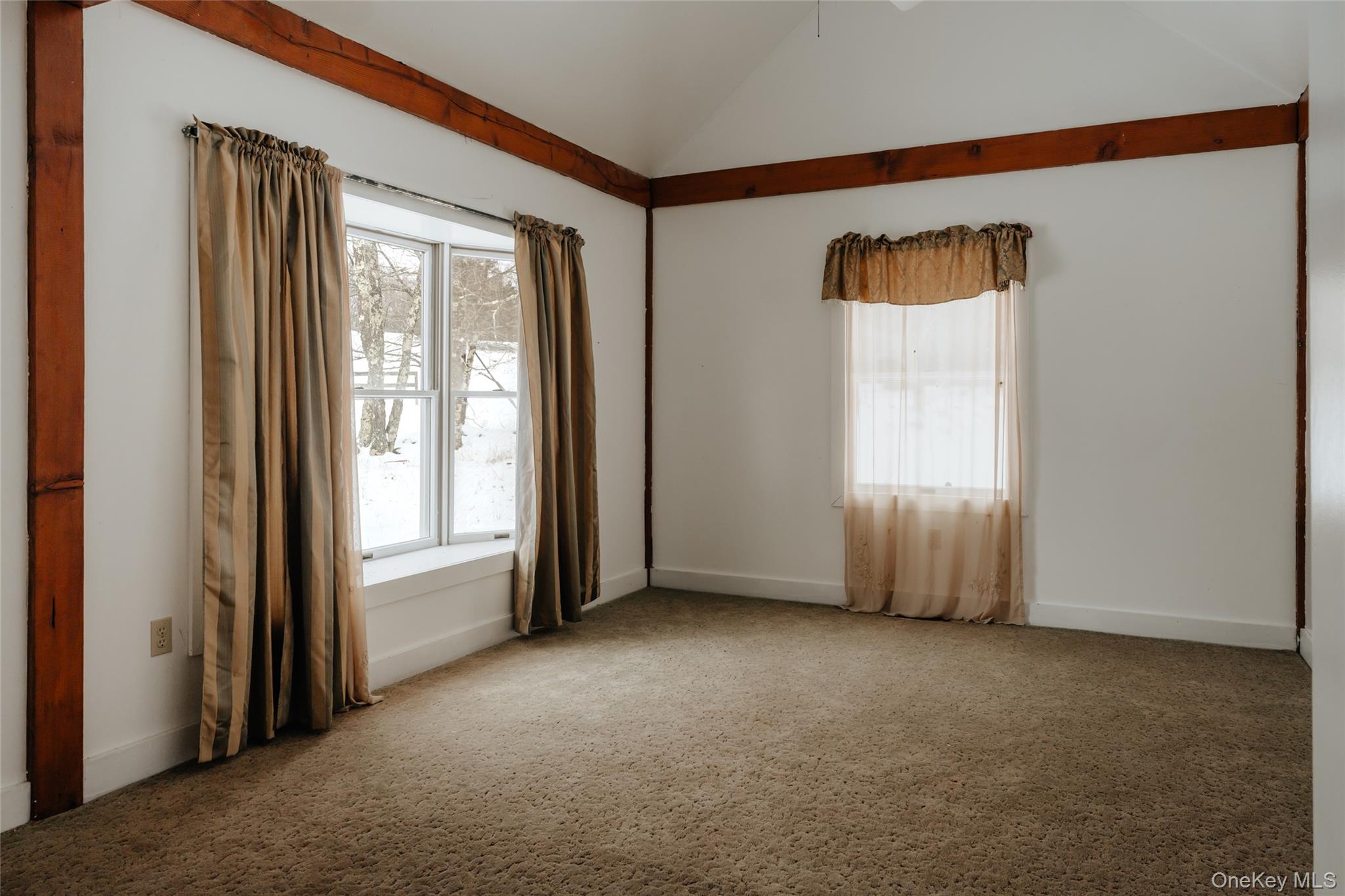 26 Beckys Hill Road Loch Sheldrake, NY 12759 - Photo 28 of 50 Unfurnished room with lofted ceiling, healthy amount of natural light, and carpet flooring
