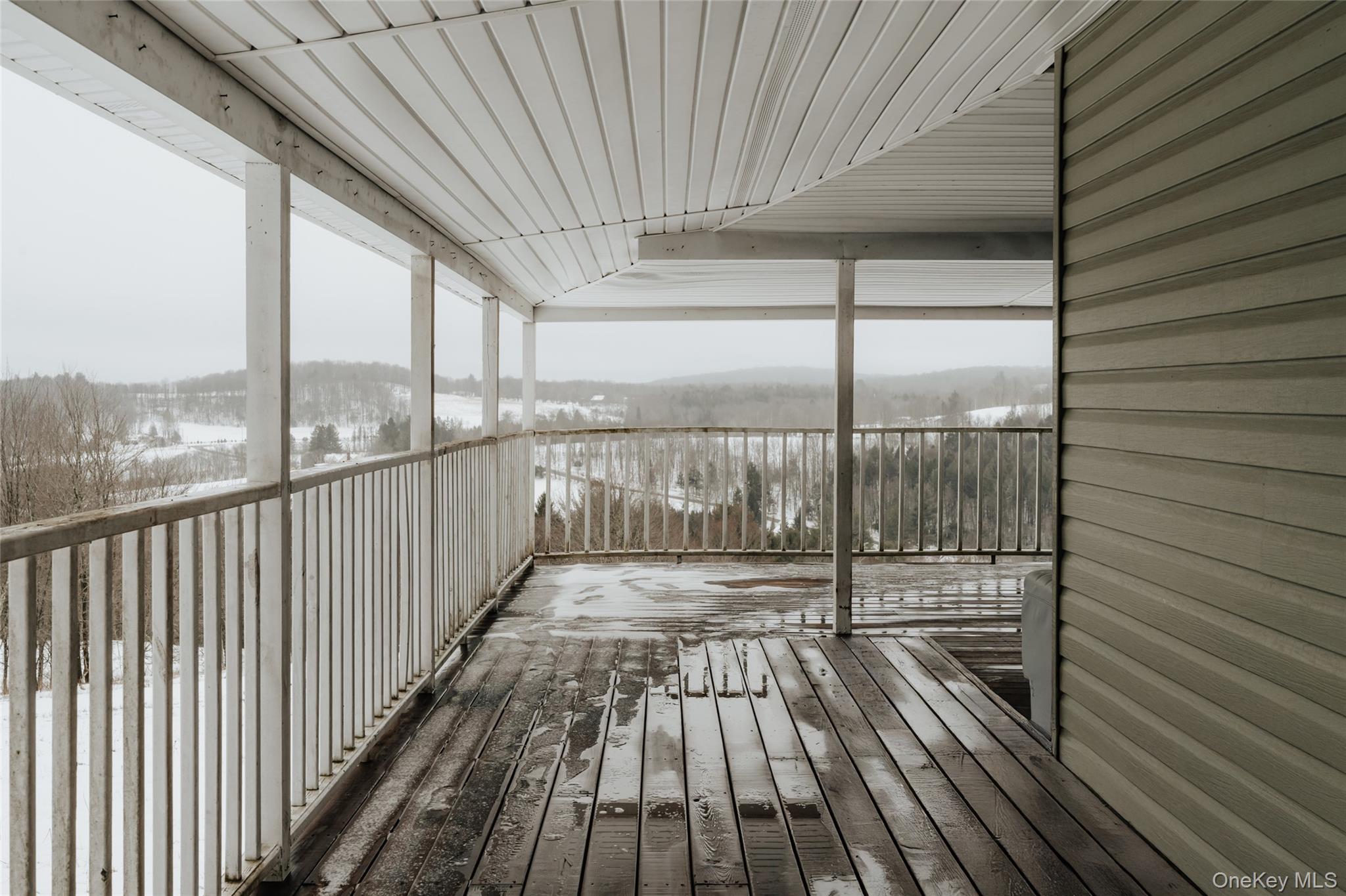 26 Beckys Hill Road Loch Sheldrake, NY 12759 - Photo 6 of 50 Snow covered deck featuring a sunroom and a mountain view