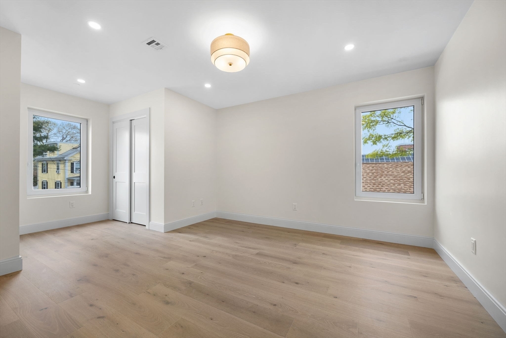 148 Myrtle Street, Unit 4 Melrose, MA 02176 - Photo 16 of 35 an empty room with windows