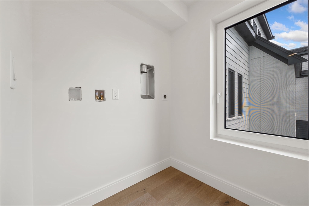 148 Myrtle Street, Unit 4 Melrose, MA 02176 - Photo 19 of 35 a view of a small space with wooden floor and a window