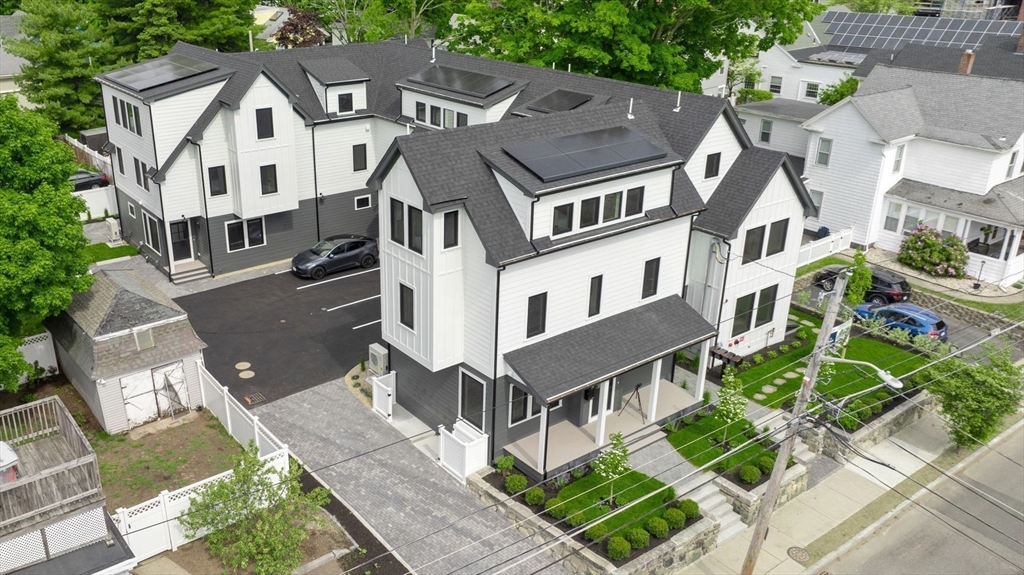 148 Myrtle Street, Unit 4 Melrose, MA 02176 - Photo 33 of 35 an aerial view of residential houses with yard