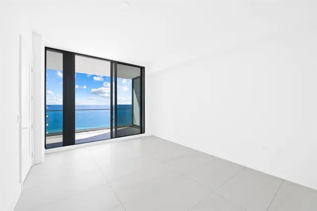 a balcony with furniture and a window
