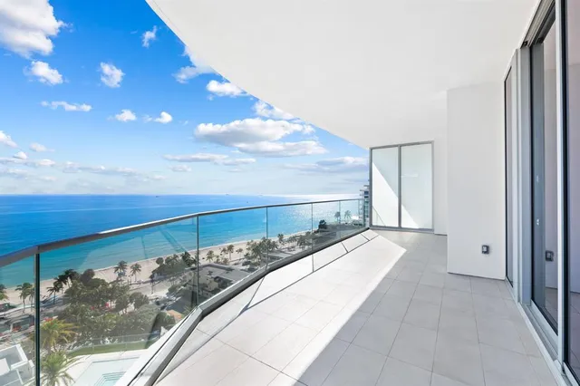 a hallway with sink and mirror