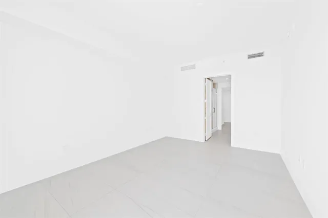 a view of a backyard with a slide and potted plants