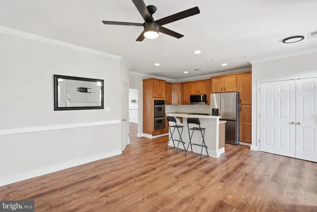 a view of a kitchen with a table and chairs