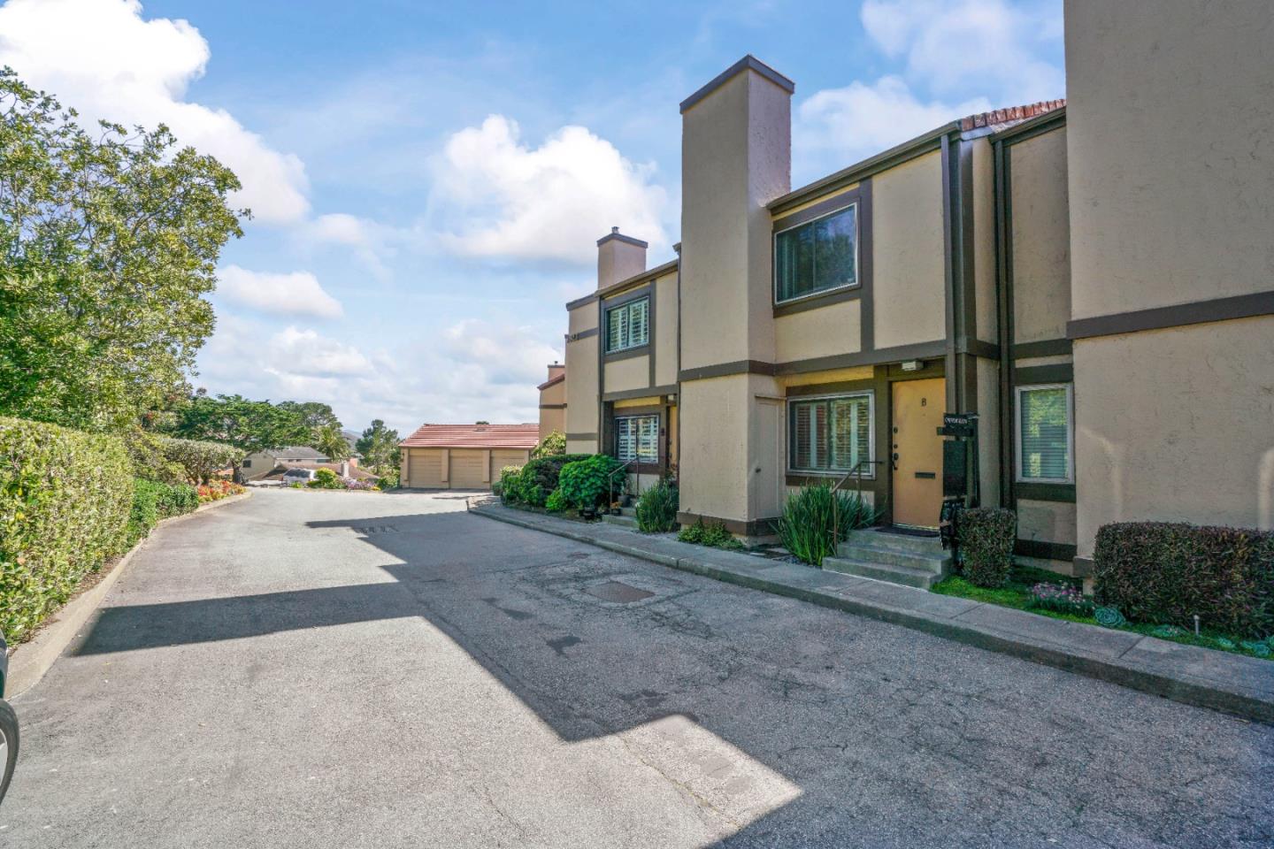 623 Hickey Boulevard, Unit B Pacifica, CA 94044 - Photo 4 of 25 a city street lined with tall buildings