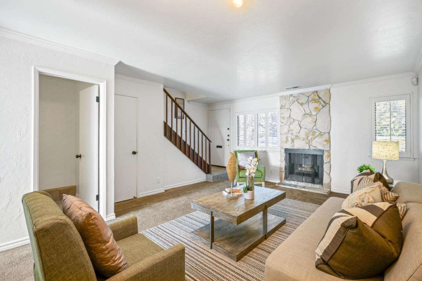 623 Hickey Boulevard, Unit B Pacifica, CA 94044 - Photo 8 of 25 a living room with furniture and a fireplace