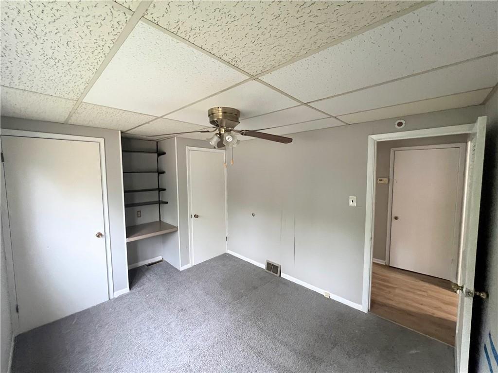 7726 Michigan Road Pittsburgh, PA 15235 - Photo 2 of 6 a view of empty room with a windows and a ceiling fan