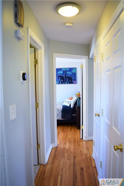 24 North Pennington Road New Brunswick, NJ 08901 - Photo 20 of 47 a bedroom with a bed and a view of en suite bathroom