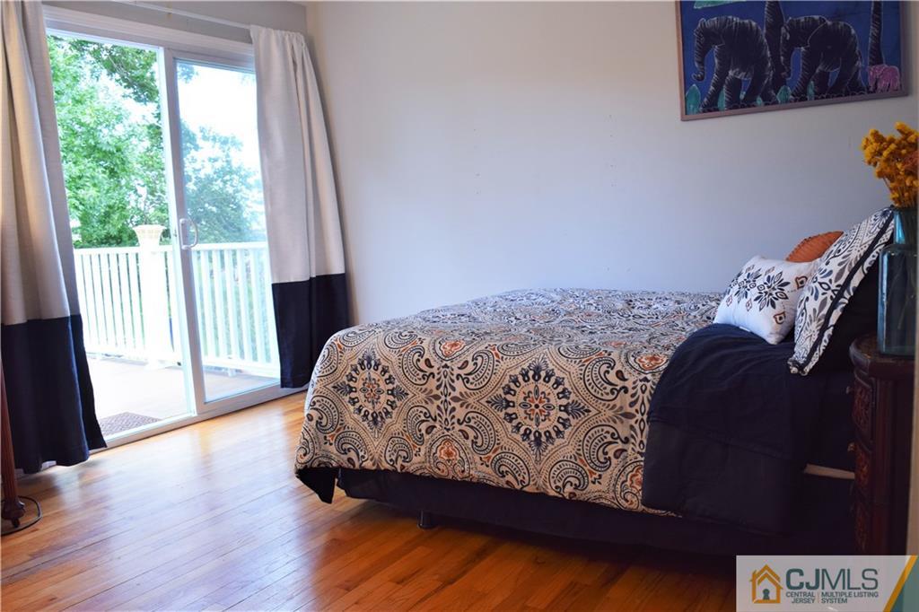 24 North Pennington Road New Brunswick, NJ 08901 - Photo 22 of 47 a bed sitting in a bedroom next to a window