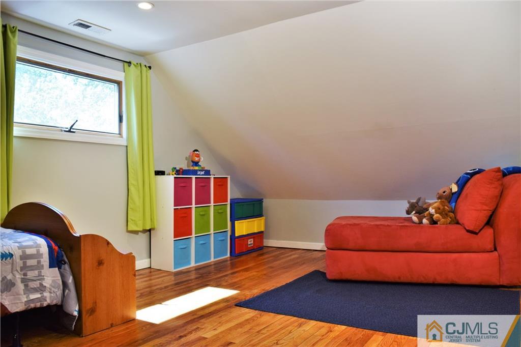 24 North Pennington Road New Brunswick, NJ 08901 - Photo 28 of 47 a bedroom with two beds and a lamp