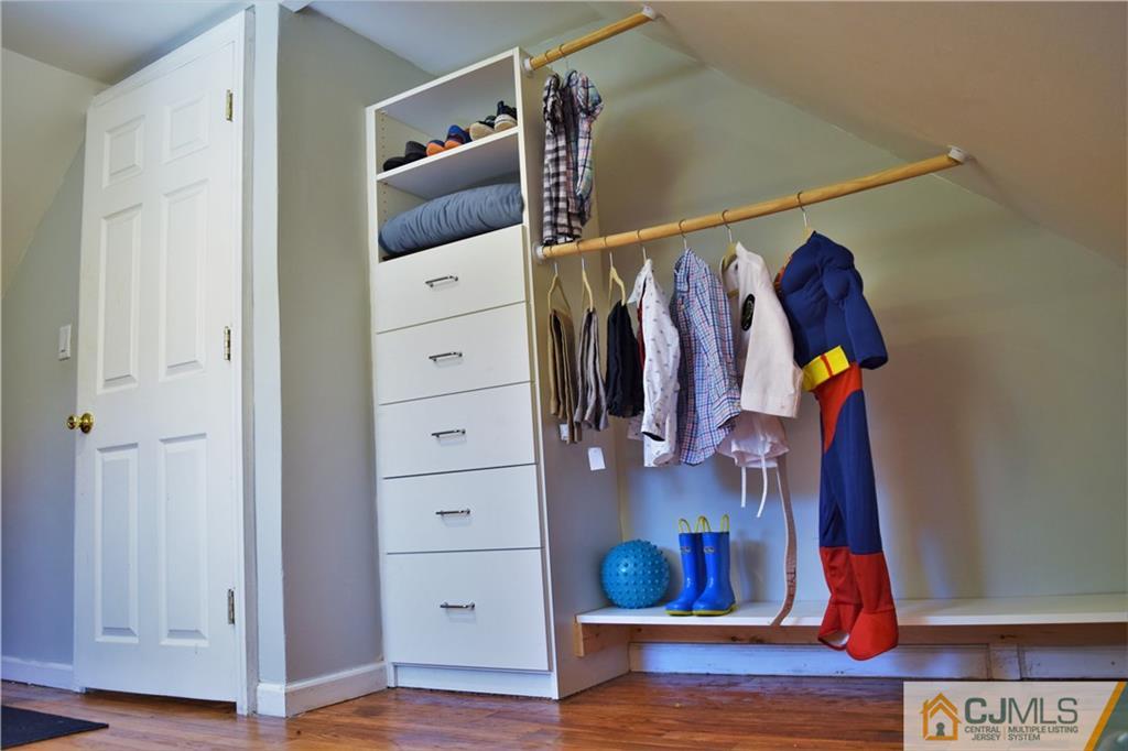 24 North Pennington Road New Brunswick, NJ 08901 - Photo 30 of 47 a view of walk in closet with clothes and shoes