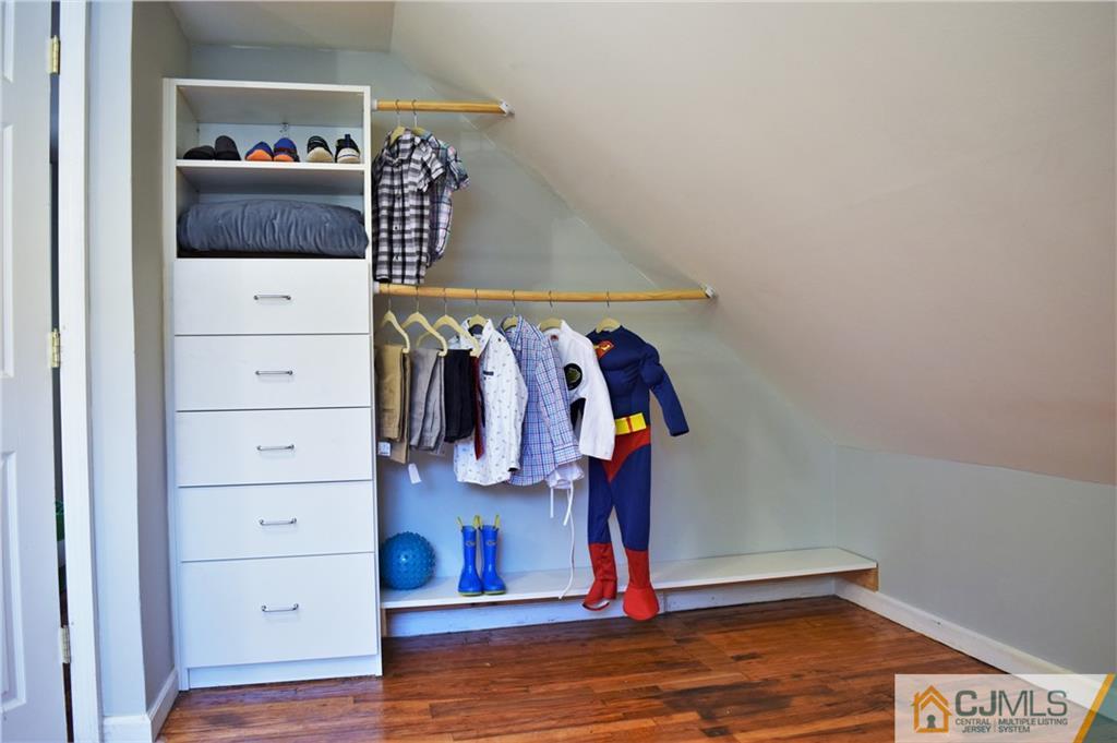 24 North Pennington Road New Brunswick, NJ 08901 - Photo 31 of 47 a view of walk in closet with clothes and shoes