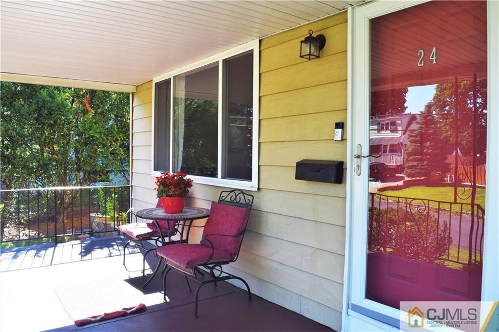 24 North Pennington Road New Brunswick, NJ 08901 - Photo 5 of 47 a view of a balcony with chairs and a potted plant