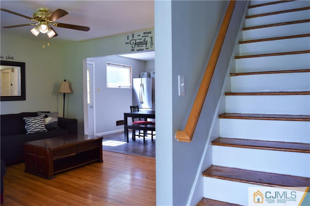 24 North Pennington Road New Brunswick, NJ 08901 - Photo 6 of 47 a living room with furniture and a stair