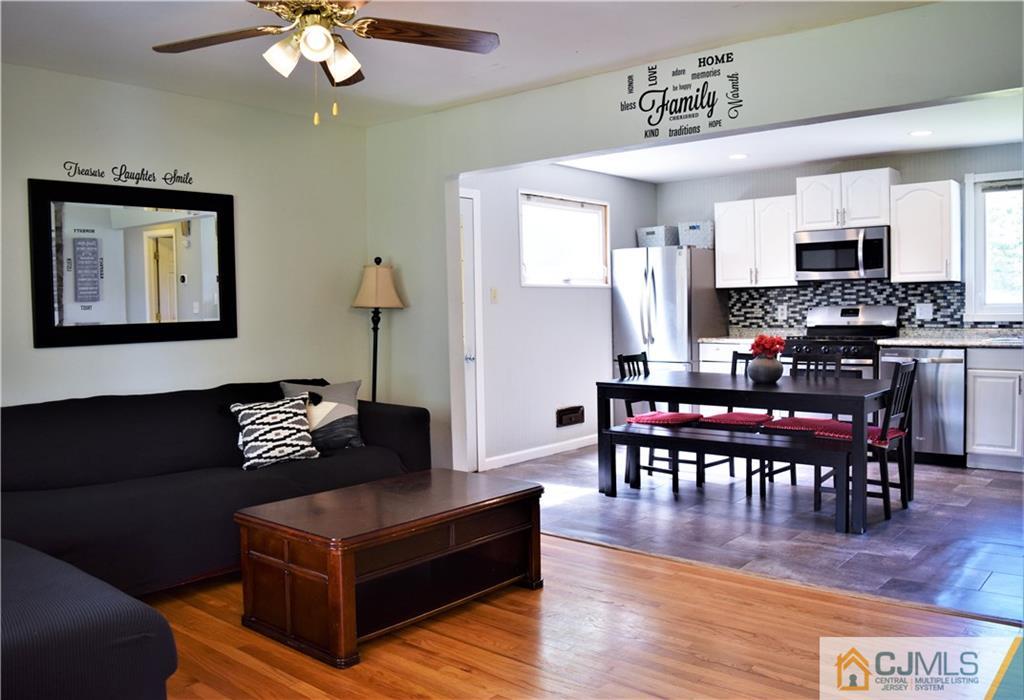 24 North Pennington Road New Brunswick, NJ 08901 - Photo 7 of 47 a living room with furniture and a wooden floor