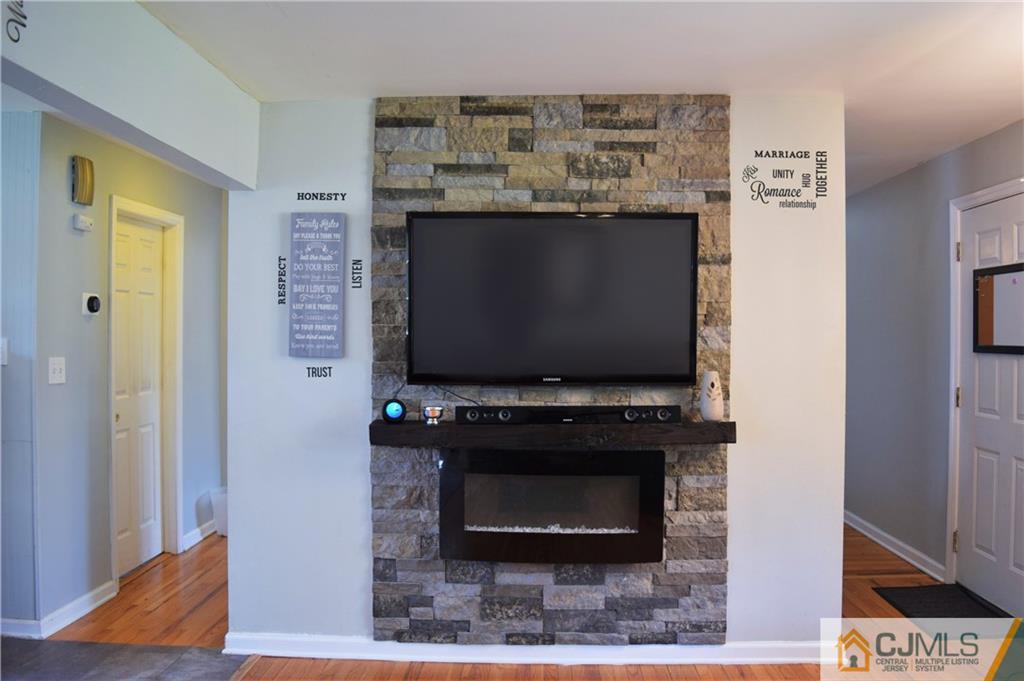 24 North Pennington Road New Brunswick, NJ 08901 - Photo 10 of 47 a room with furniture and a flat screen tv