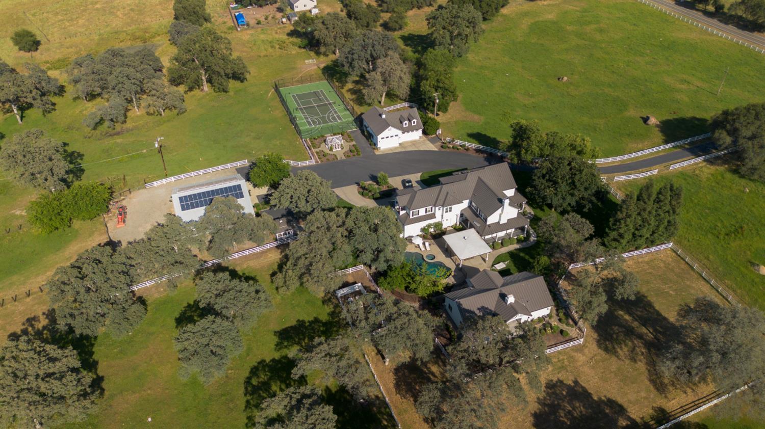 2905 Virginiatown Road Lincoln, CA 95648 - Photo 79 of 86 Expansive property featuring a main residence, additional outbuildings, a tennis court, swimming pool, and a large solar array