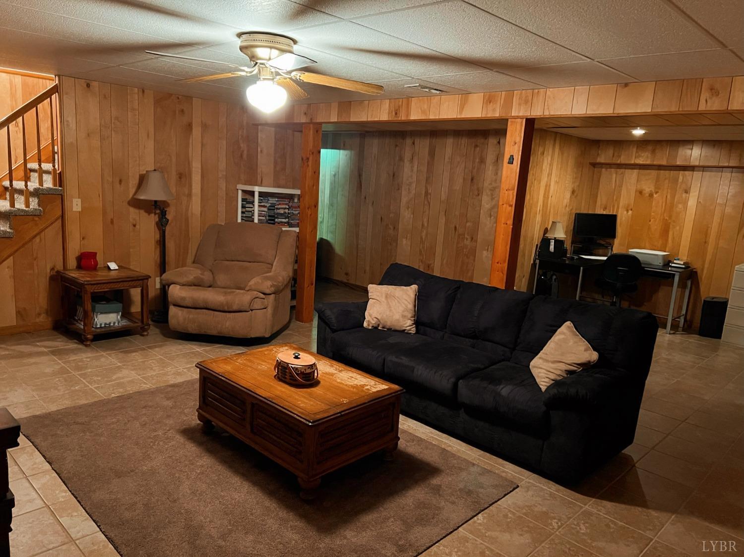 1009 Fall Creek Road Ringgold, VA 24586 - Photo 28 of 58 a living room with furniture and a chandelier