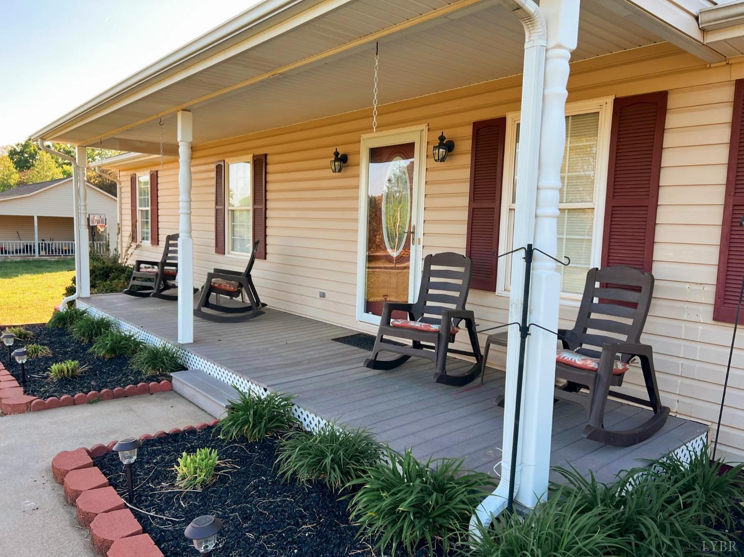 1009 Fall Creek Road Ringgold, VA 24586 - Photo 3 of 58 a view of a patio with table and chairs and potted plants
