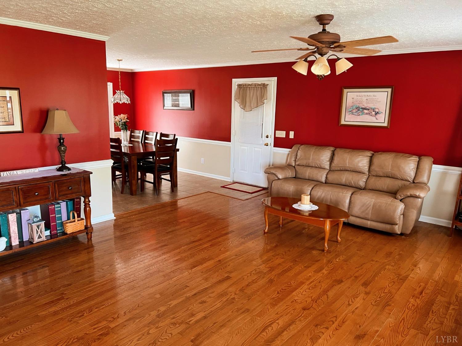 1009 Fall Creek Road Ringgold, VA 24586 - Photo 6 of 58 a living room with furniture and wooden floor