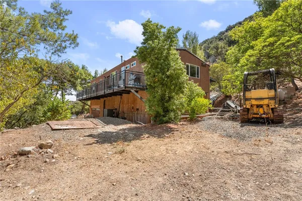 a view of balcony with wooden floor and seating space