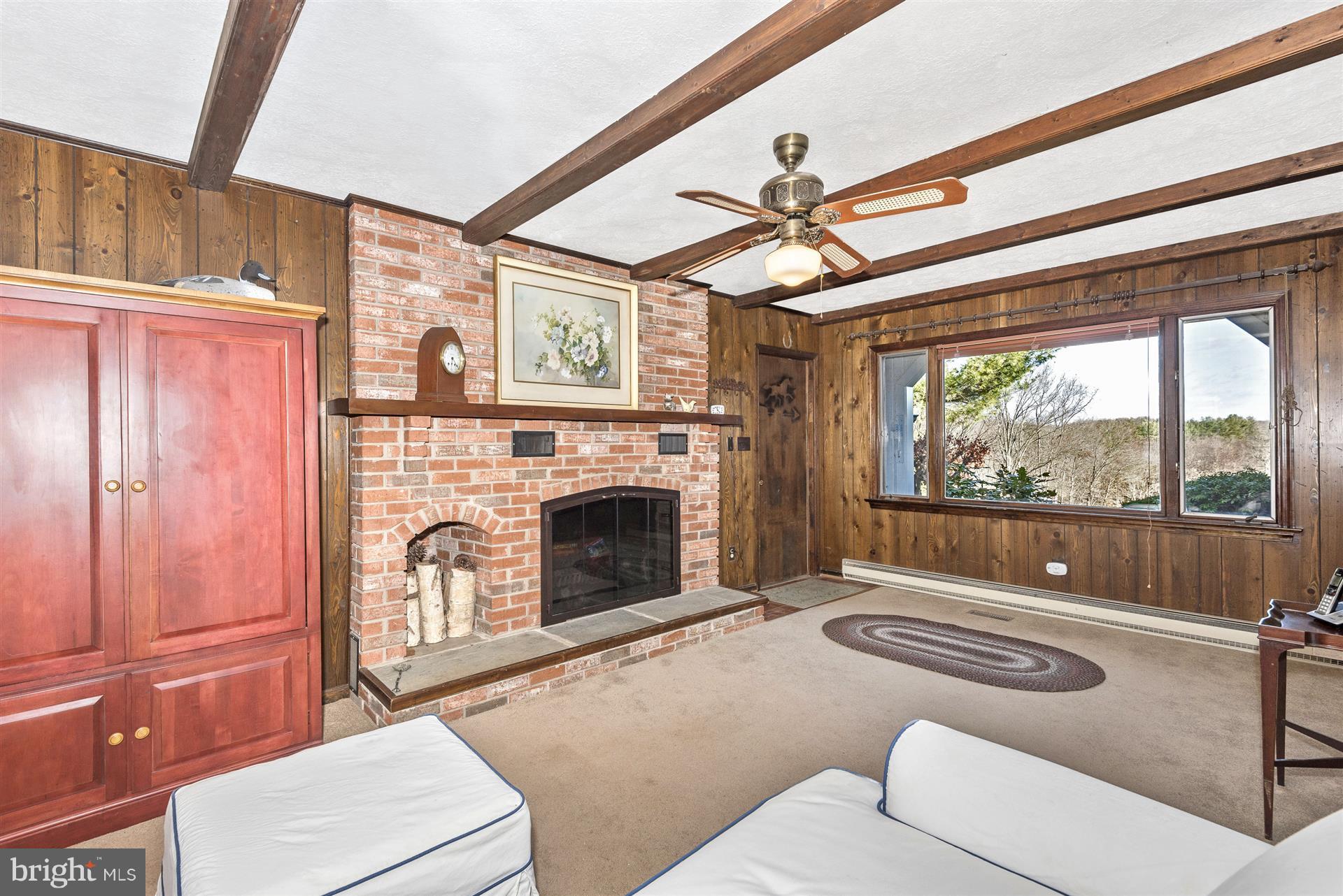 3931 Harrisville Road Mount Airy, MD 21771 - Photo 15 of 28 Picture window and fireplace welcome you.