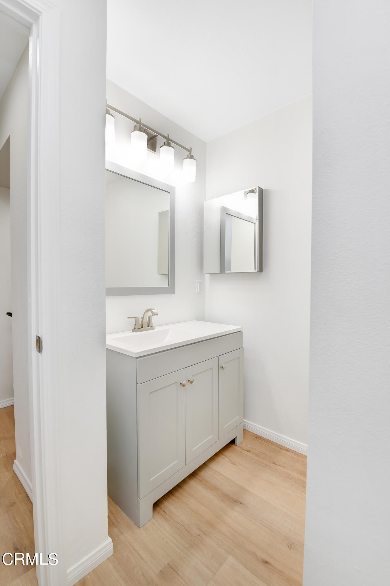 296 Foothill Drive Fillmore, CA 93015 - Photo 14 of 17 a bathroom with a sink vanity and mirror