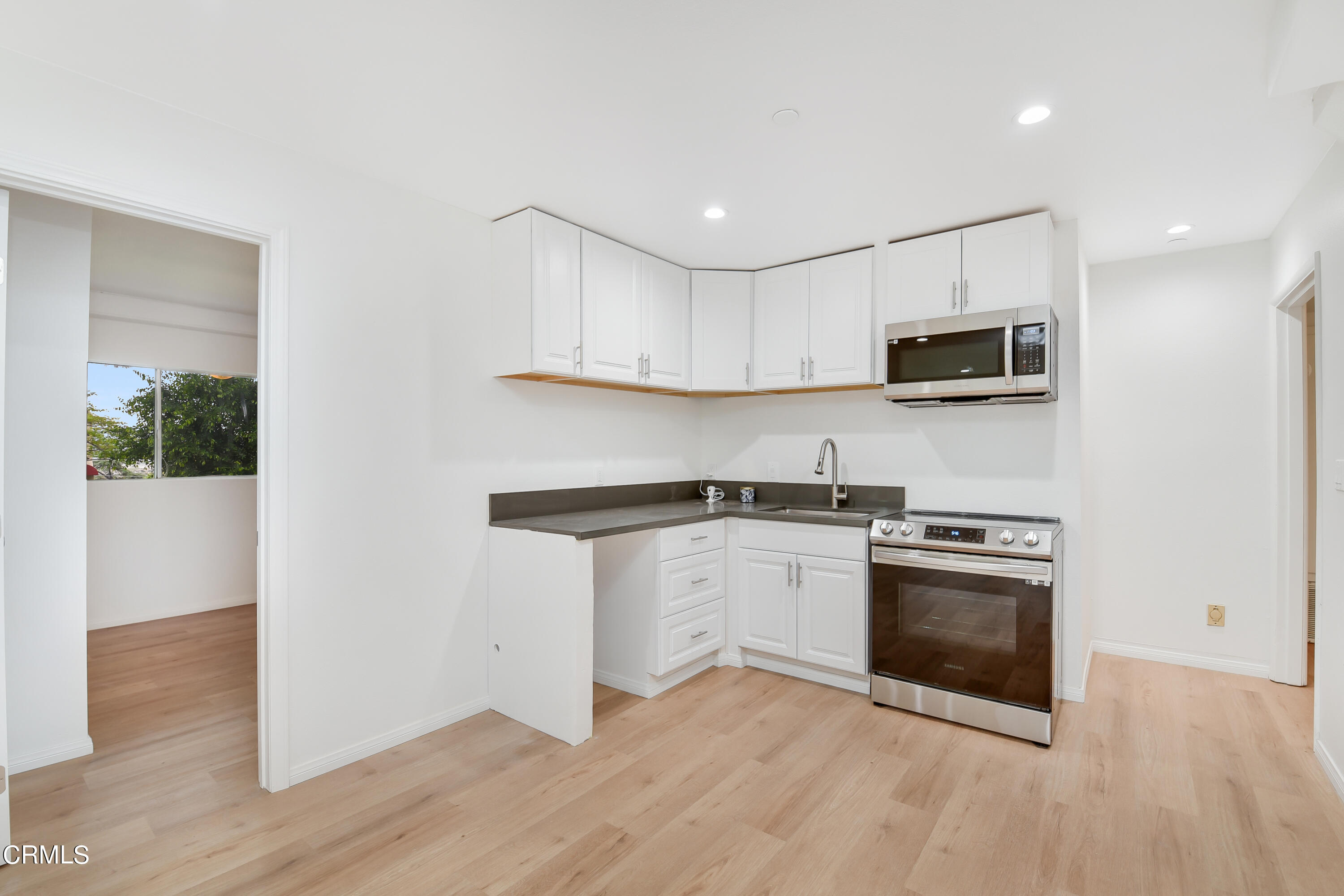 296 Foothill Drive Fillmore, CA 93015 - Photo 6 of 17 a kitchen with granite countertop a stove top oven and sink