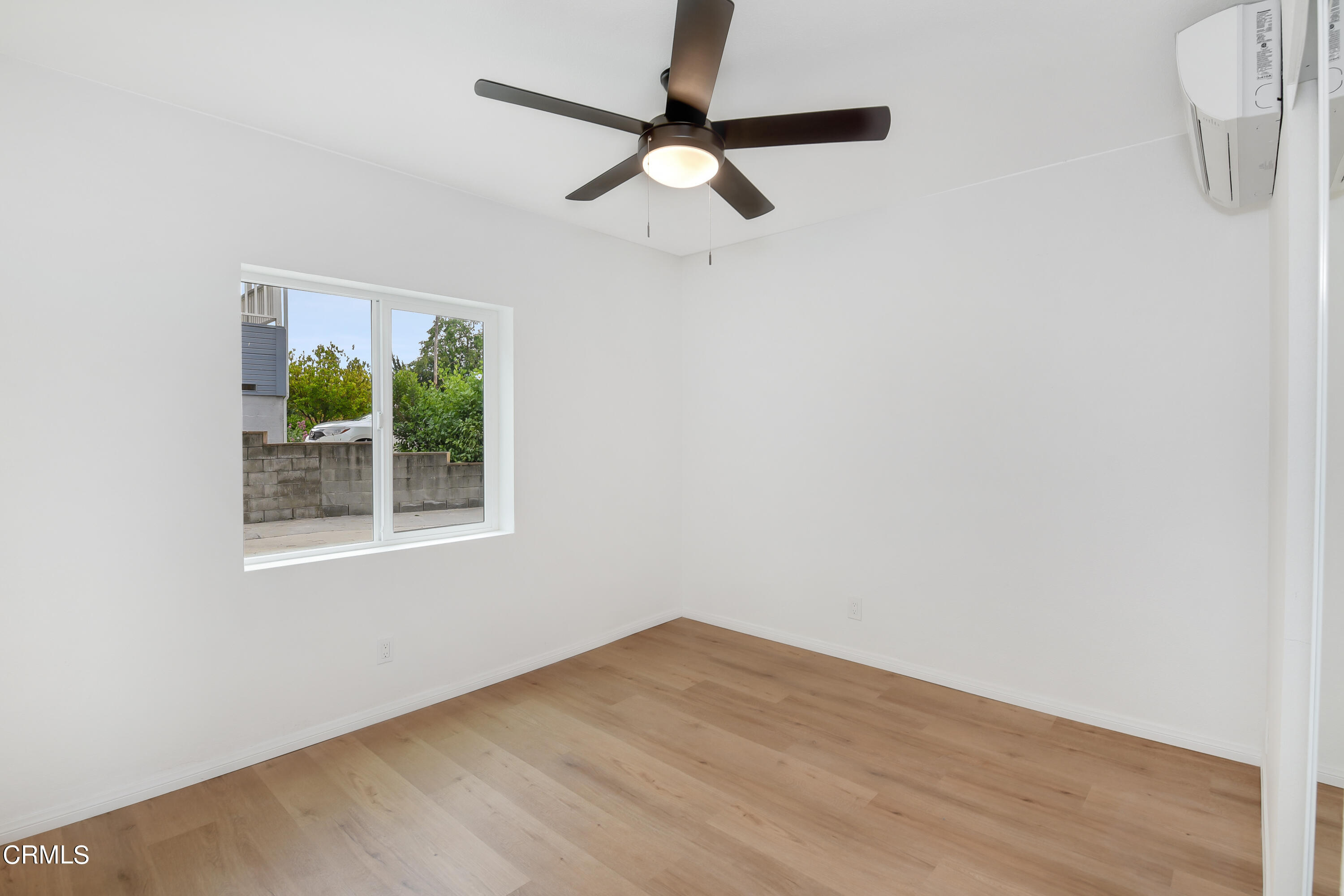 296 Foothill Drive Fillmore, CA 93015 - Photo 10 of 17 an empty room with a window and a ceiling fan
