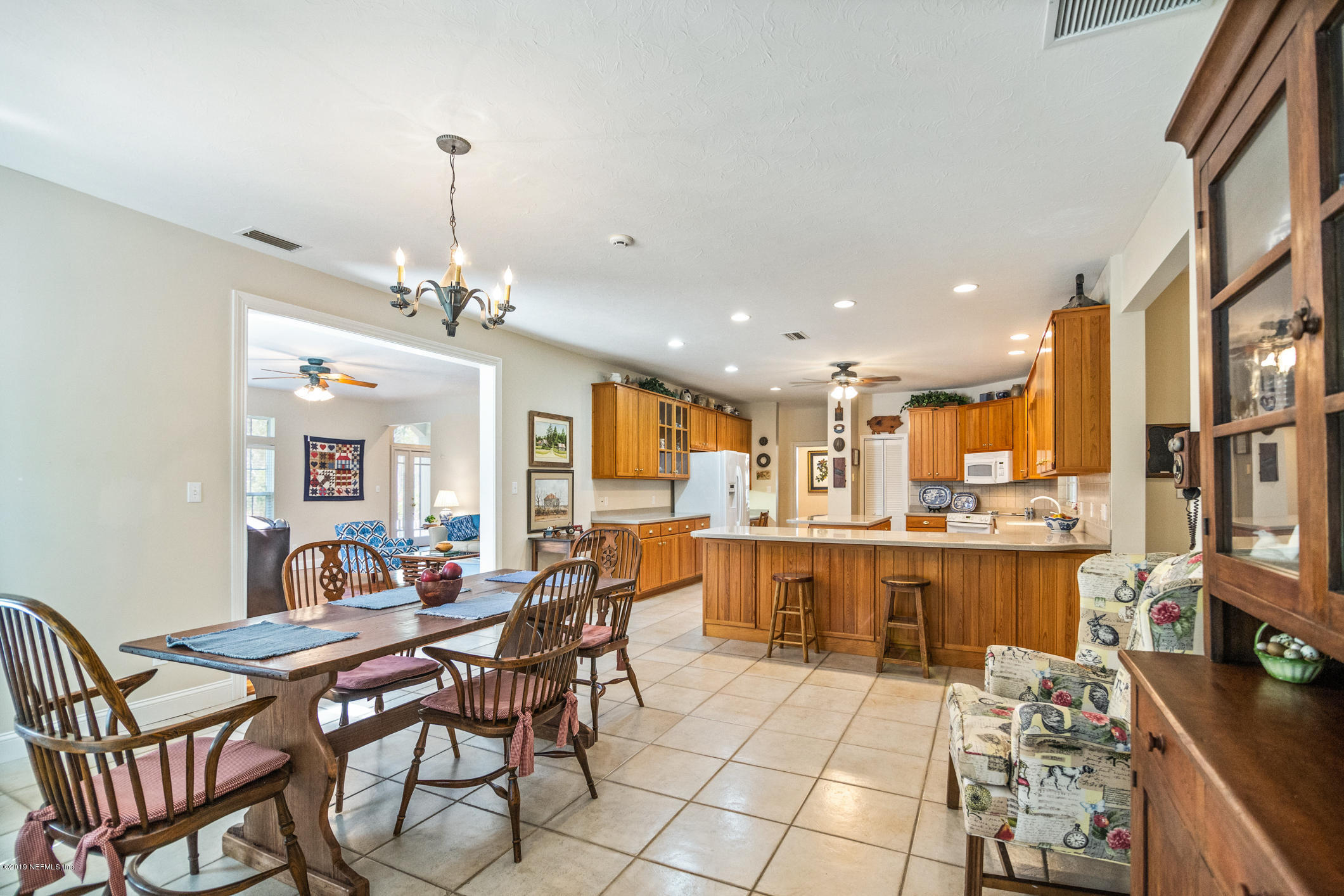 1435 Scott Road St. Johns, FL 32259 - Photo 17 of 65 a large kitchen with a table and chairs