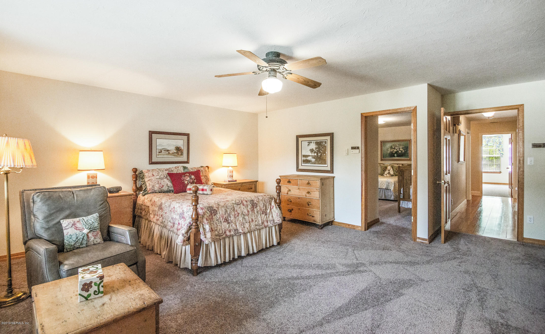 1435 Scott Road St. Johns, FL 32259 - Photo 20 of 65 a bed room with furniture and a ceiling fan
