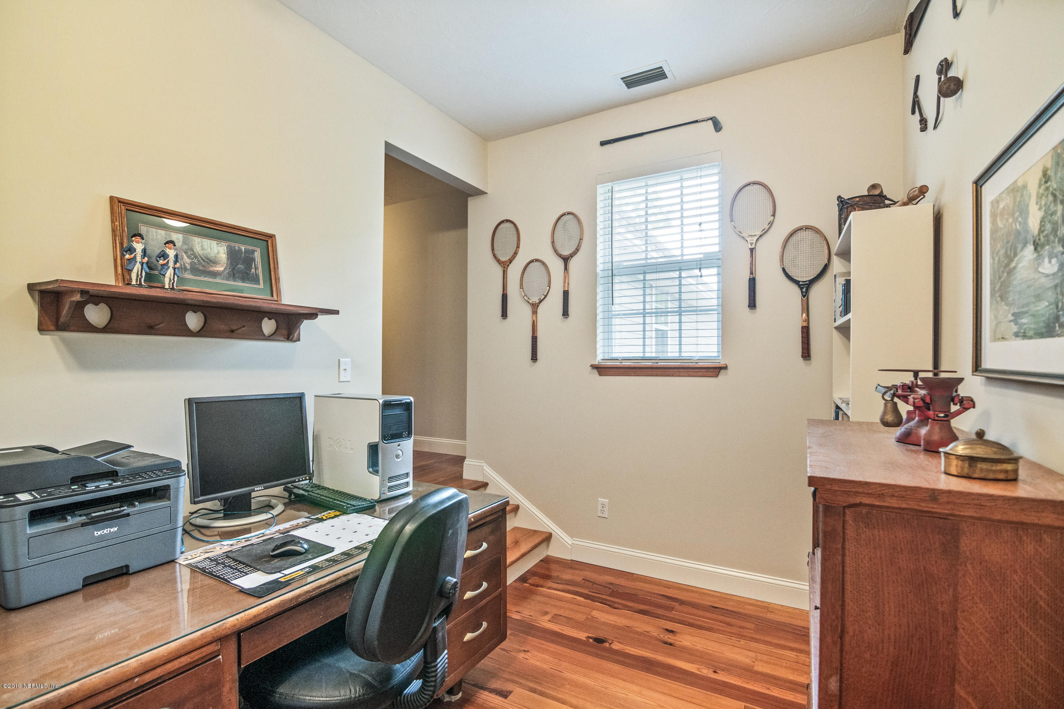 1435 Scott Road St. Johns, FL 32259 - Photo 25 of 65 a view of a workspace with furniture and a window