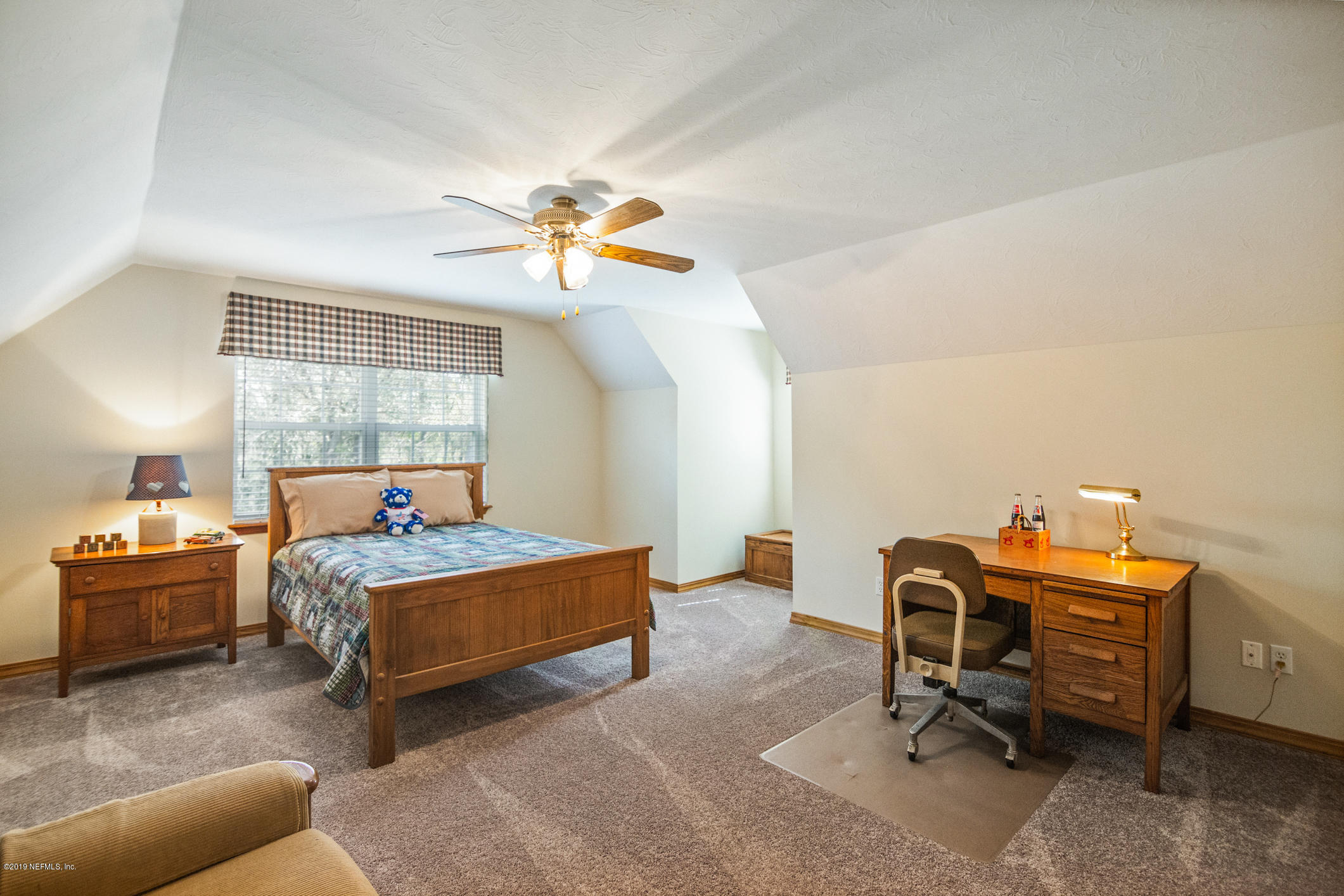 1435 Scott Road St. Johns, FL 32259 - Photo 29 of 65 a bedroom with furniture and a window