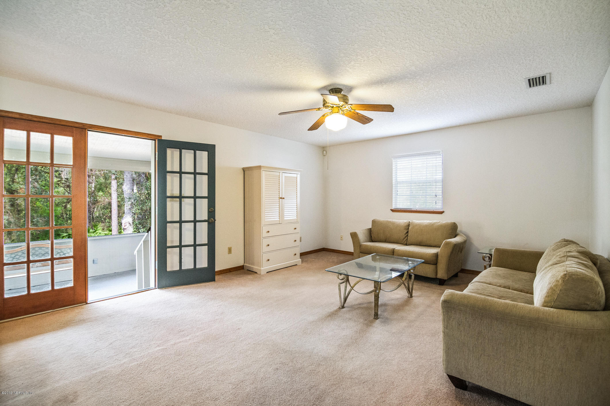 1435 Scott Road St. Johns, FL 32259 - Photo 47 of 65 a living room with furniture and a window