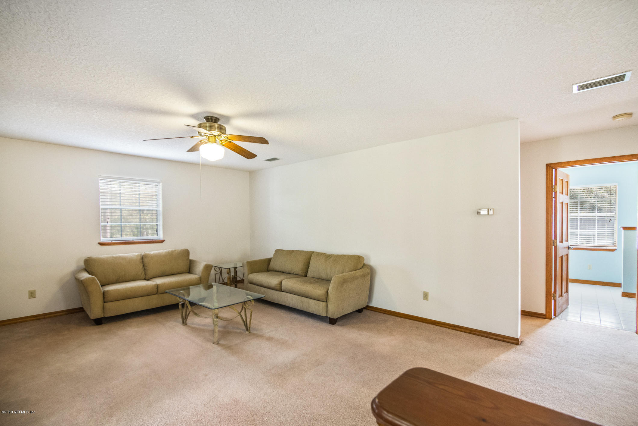 1435 Scott Road St. Johns, FL 32259 - Photo 48 of 65 a living room with furniture and a window