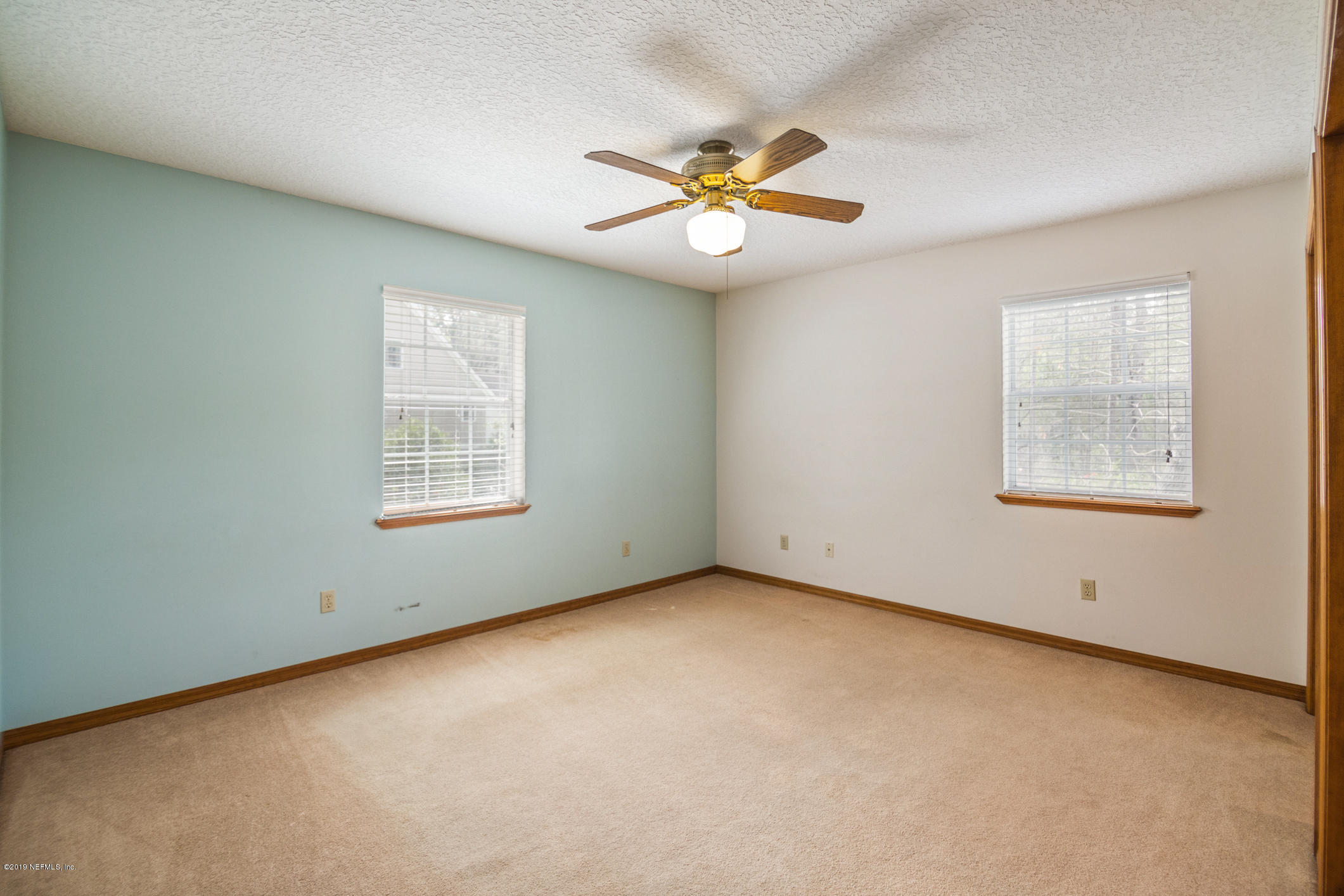 1435 Scott Road St. Johns, FL 32259 - Photo 49 of 65 an empty room with windows and fan