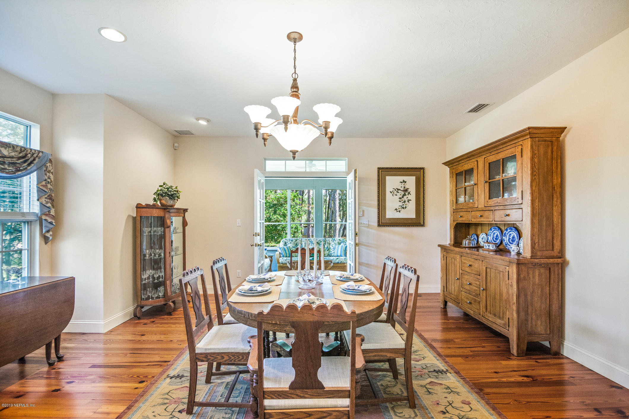 1435 Scott Road St. Johns, FL 32259 - Photo 6 of 65 a view of a dining room with furniture wooden floor and chandelier