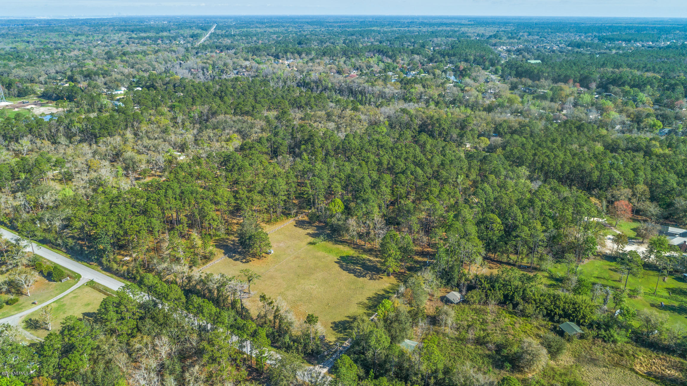 1435 Scott Road St. Johns, FL 32259 - Photo 64 of 65 a view of a forest with a street